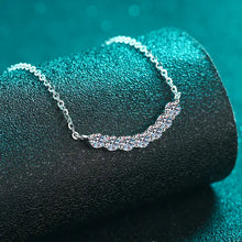 Sterling silver curved length pendant necklace with 1 carat moissanite moon and CZ stones