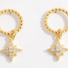 Sterling silver dangle earrings with gold star charms and cubic zirconia