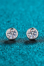 Pair of round bezel-set diamond stud earrings in sterling silver with limited warranty included