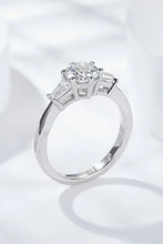 Sterling silver engagement ring with princess cut moissanite and baguette diamonds symbolizing loyal love