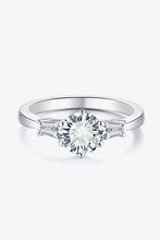 Sterling silver engagement ring with round brilliant-cut diamond and baguettes