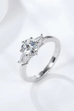 Sterling silver engagement ring with round diamond, baguettes, loyal love