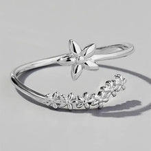 Sterling silver flower ring with adjustable floral wrap-around design