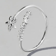 Sterling silver flower ring with adjustable floral wrap-around design