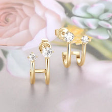 Pair of sterling silver gold ear climbers with round cubic zirconia studs