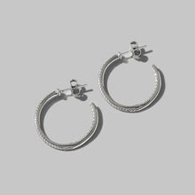 Pair of sterling silver hoop earrings with pave cubic zirconia