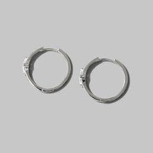 Sterling silver hoop earrings with inlaid zircon pavé accents
