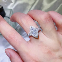 Sterling silver marquise cut halo engagement ring with baguette side stones