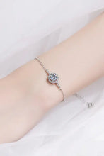 Sterling silver moissanite chain bracelet with sparkling flower centerpiece