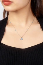 Sterling silver necklace with accent stones and carat moissanite pendant
