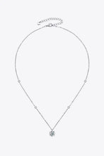 Sterling silver necklace with accent stones and carat moissanite pendant