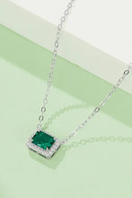 Sterling silver necklace with emerald rectangle pendant and diamond accents