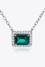 Sterling silver necklace with emerald rectangle pendant and diamond accents