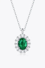 Sterling silver necklace with lab-grown emerald oval pendant and matching box