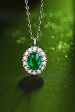 Sterling silver necklace with lab-grown emerald oval pendant and diamonds