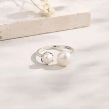 Sterling silver open ring with adjustable pearl band