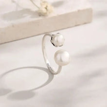 Sterling silver open ring with pearl adjustable band