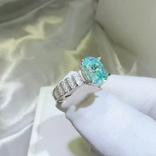 Elegant sterling silver oval aquamarine ring with pavé band