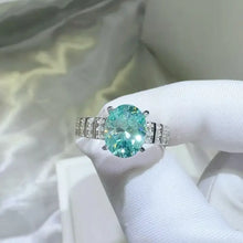 Elegant sterling silver oval aquamarine ring with pavé band