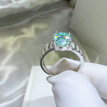 Sterling silver oval aquamarine ring with pavé band and side stones
