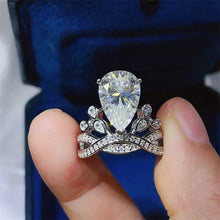 Sterling silver pear cut diamond ring with floral pavé band