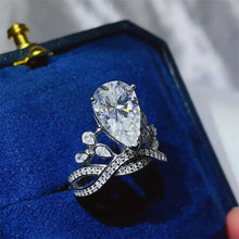 Pear-shaped sterling silver ring with diamond and pavé band