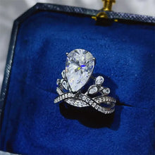 Pear-shaped sterling silver ring with pavé band in blue box