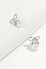 Sterling silver pearl bow earrings with dangling pearl drops