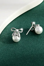 Elegant sterling silver pearl bow earrings with studs