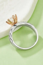 Sterling silver ring with 1 carat moissanite in gold prong setting