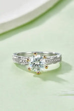 Sterling silver ring with 1 carat moissanite in gold prong setting