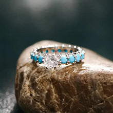 Sterling silver ring with center diamond and inlaid artificial turquoise
