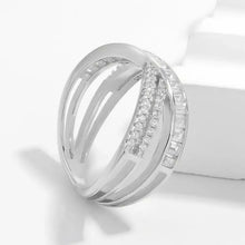 Sterling silver ring with crisscross inlaid zircon baguette and round cuts