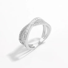 Modern sterling silver ring with crisscross design and inlaid zircon stones