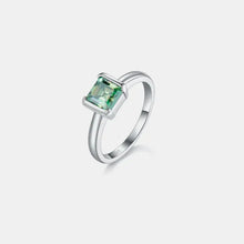 Sterling silver ring with emerald-cut green gemstone