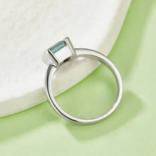 Sterling silver ring with emerald cut teal gemstone