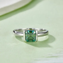 Sterling silver ring with emerald-cut green gemstone