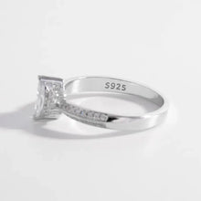 Sterling silver ring with inlaid zircon and pave side stones