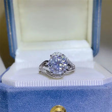 Sterling silver ring with large carat moissanite and pavé accents
