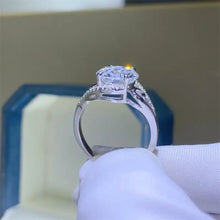 18k white gold ring with large carat moissanite and pavé accents