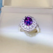 Sterling silver ring with oval purple gemstone and carat moissanite halo