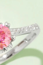 Sterling silver ring with pink moissanite gem and pavé diamonds in matching box