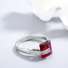 Sterling silver ring with square red gemstone and diamond accents