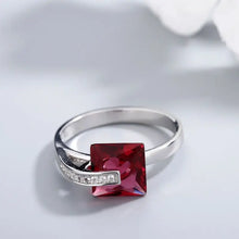 Sterling silver ring with square red gemstone and diamond accents
