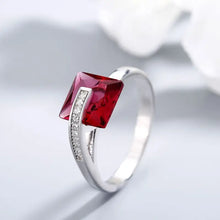 Sterling silver ring with square red gemstone and diamond accents