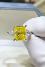 Sterling silver ring with radiant cut yellow diamond and trapezoid side stones