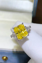 Sterling silver ring with radiant-cut yellow diamond, trillion side stones