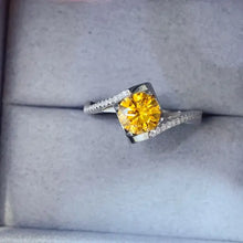 Sterling silver ring with yellow 1-carat moissanite and pavé diamond accents