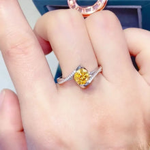 Sterling silver ring with vibrant yellow carat moissanite and pavé diamonds