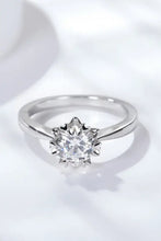 Sterling silver solitaire ring with round brilliant diamond in star setting